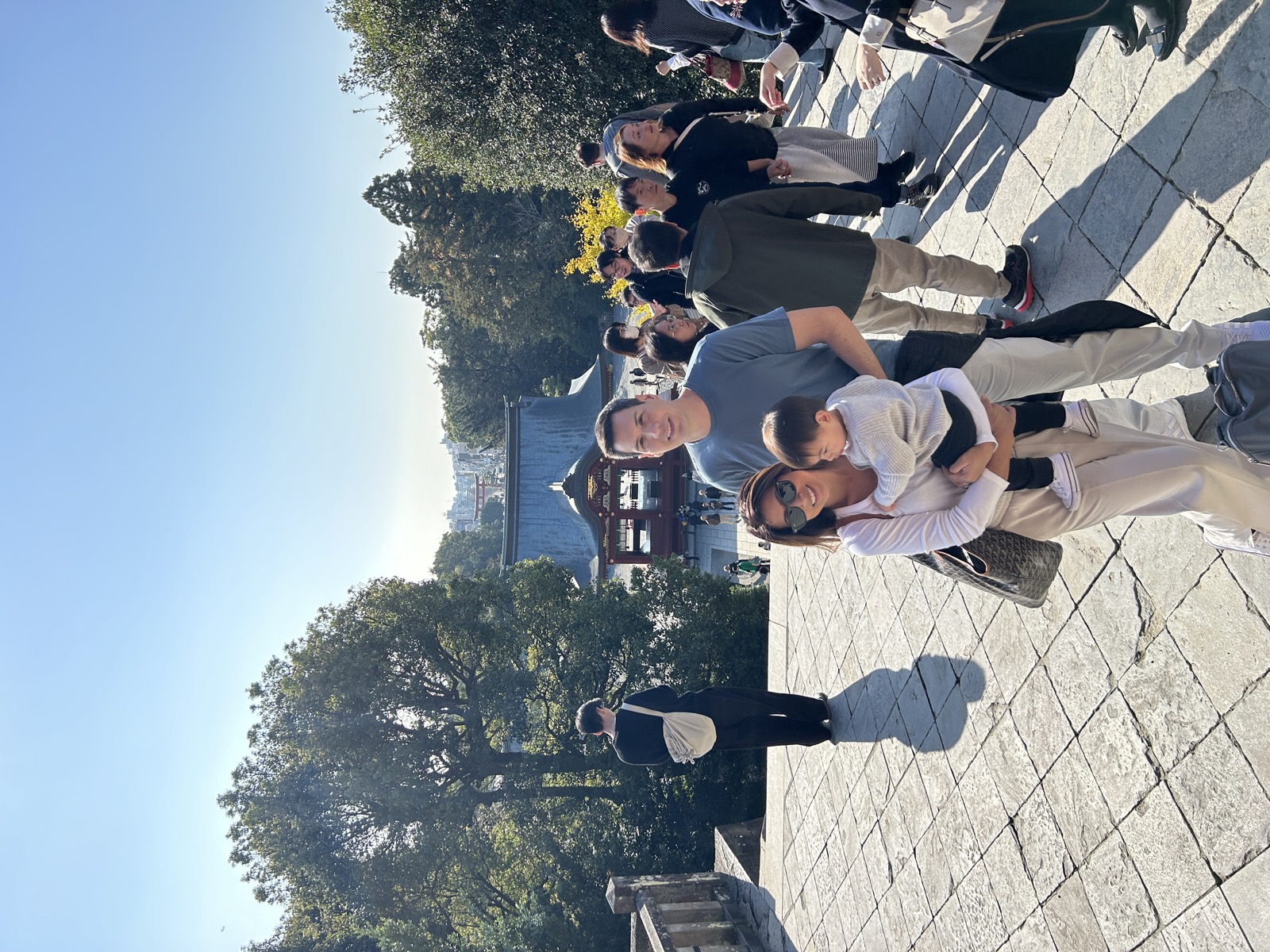 A family on the tour at a shrine in Kamakura